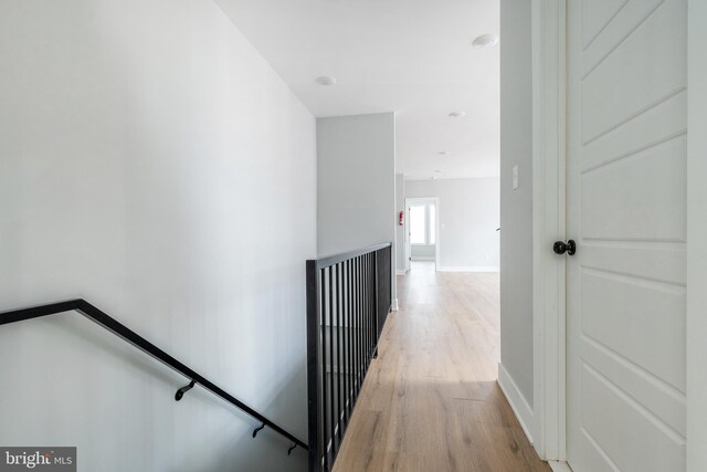 hall with light hardwood / wood-style flooring