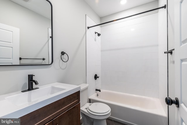 full bathroom featuring vanity, toilet, and tiled shower / bath