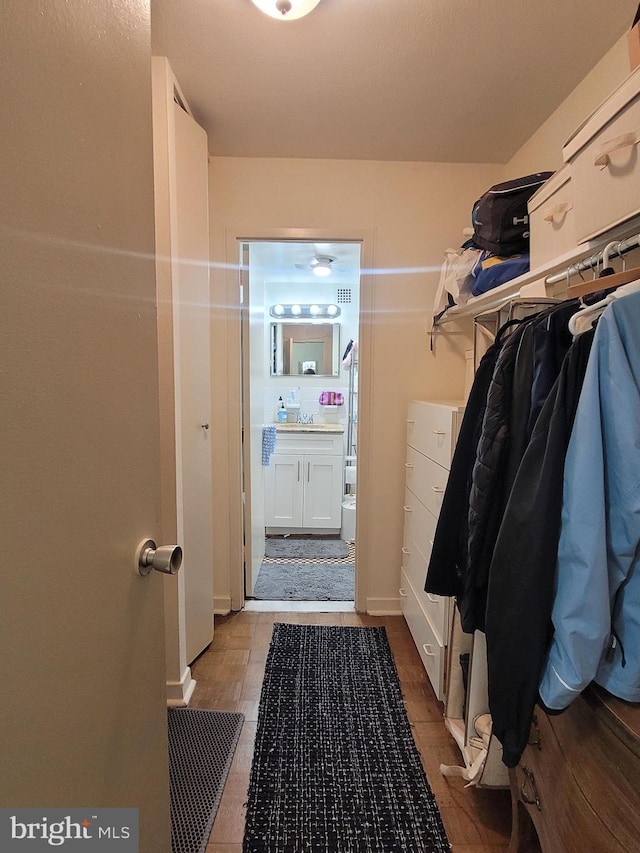 spacious closet featuring tile patterned flooring