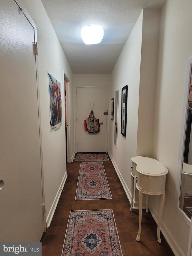 hall with dark wood-type flooring