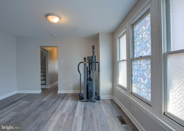 workout room with light wood-type flooring