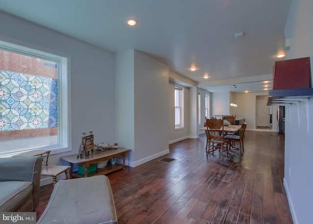 dining room with dark wood-type flooring