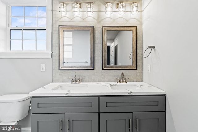 bathroom featuring vanity and toilet