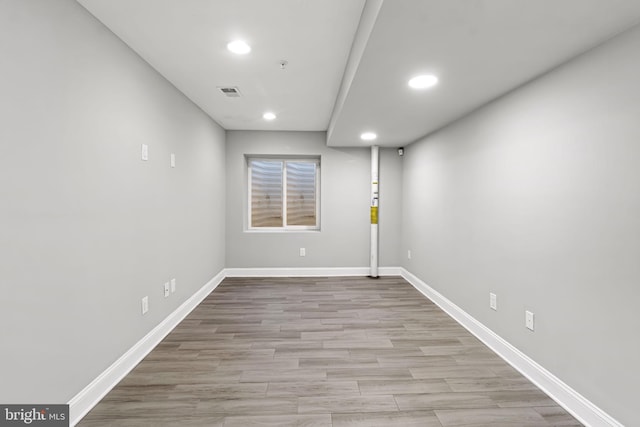 spare room featuring light hardwood / wood-style floors