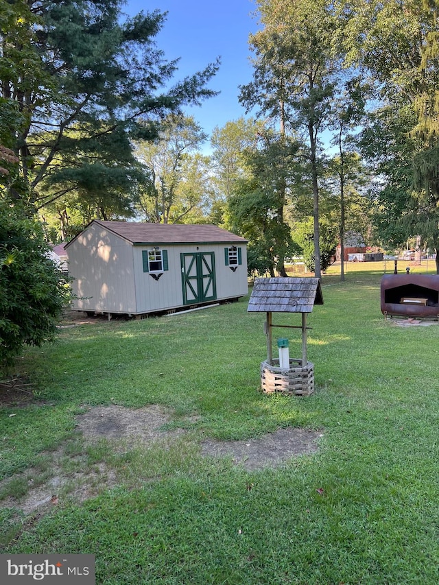 view of yard with an outdoor structure and a shed