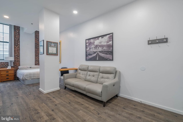 interior space featuring recessed lighting, wood finished floors, and baseboards