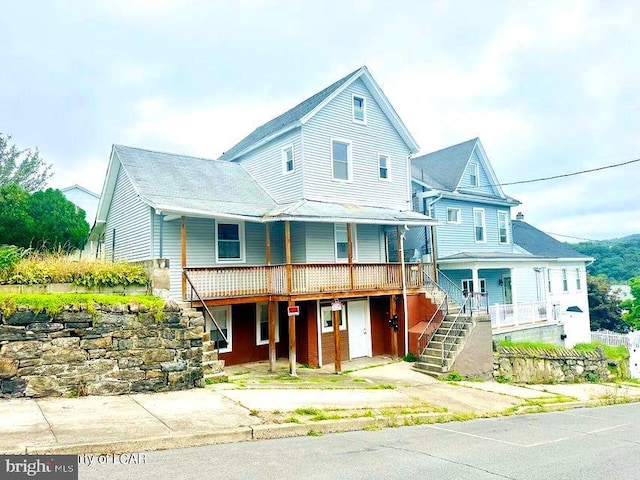 view of front of property with stairway