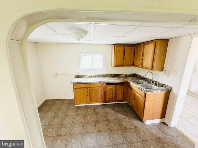 kitchen with sink and a drop ceiling