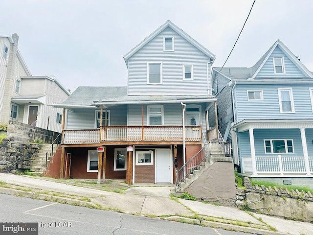 view of front of home featuring stairway