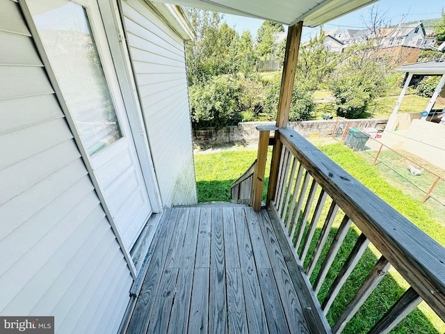 wooden deck with a yard