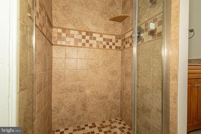 bathroom with a shower with door