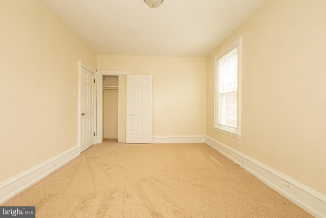 spare room with light carpet