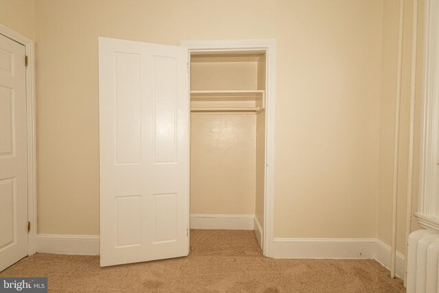 closet featuring radiator heating unit