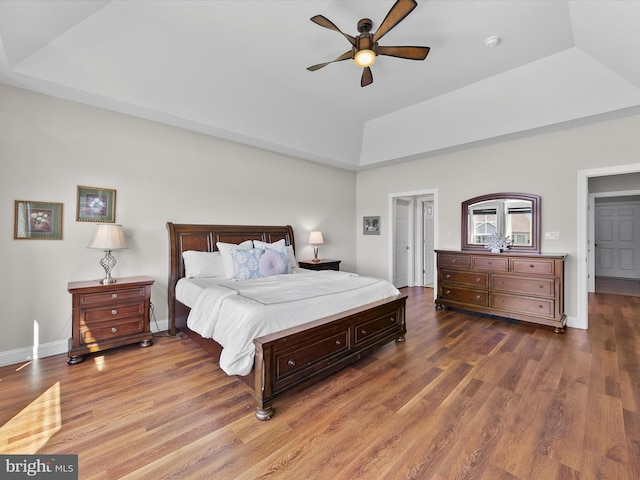 bedroom featuring vaulted ceiling, wood-type flooring, and ceiling fan