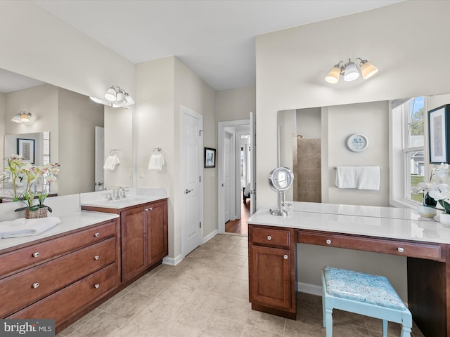 bathroom featuring tile patterned floors, walk in shower, and vanity