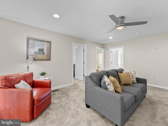 living room featuring ceiling fan and light carpet