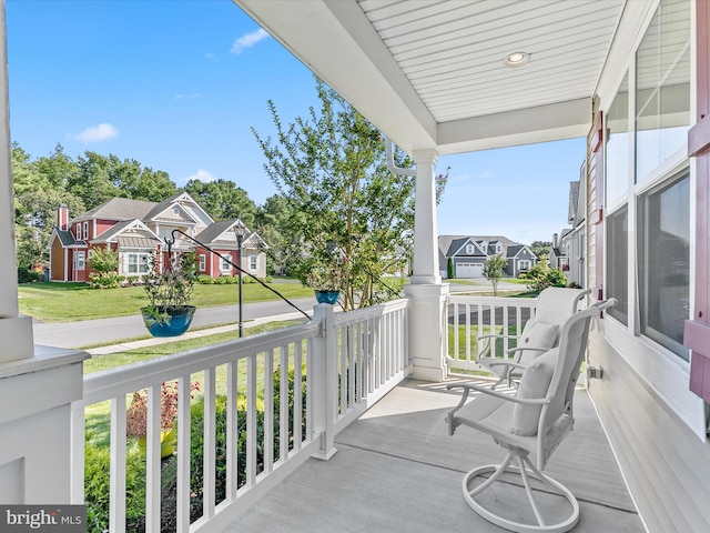 balcony featuring a residential view and covered porch