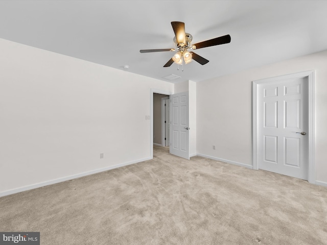 unfurnished bedroom featuring light colored carpet and ceiling fan