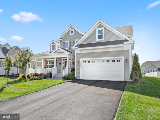 craftsman-style home with a front yard and a porch