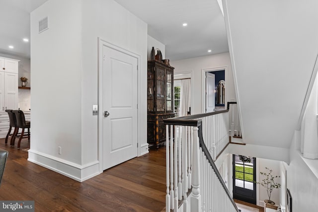 corridor with dark wood-type flooring