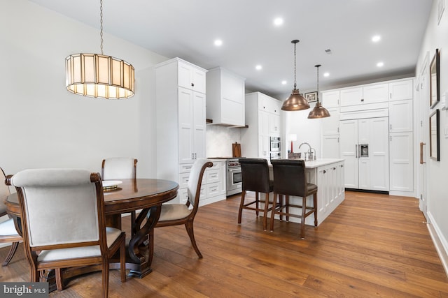 dining area featuring hardwood / wood-style flooring