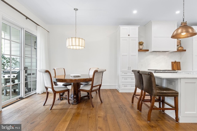 dining area with light hardwood / wood-style flooring