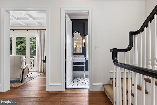 entryway featuring coffered ceiling, dark hardwood / wood-style floors, sink, and beam ceiling