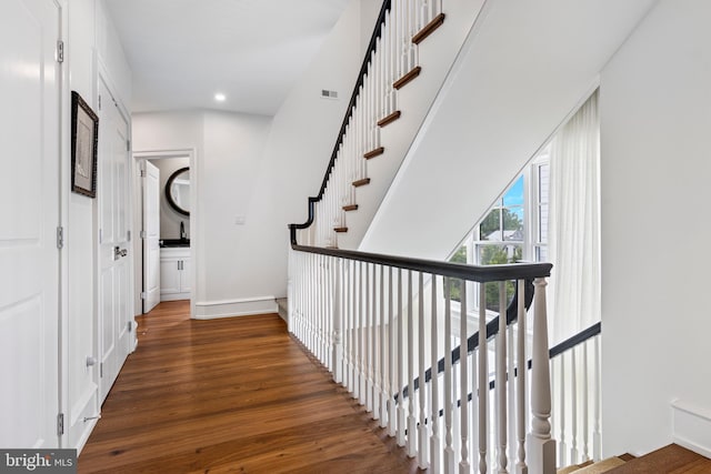 hallway featuring dark hardwood / wood-style flooring