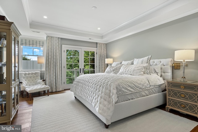 bedroom featuring crown molding, french doors, wood-type flooring, and multiple windows