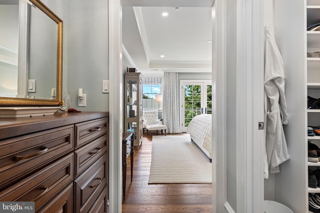 bathroom featuring crown molding, vanity, and hardwood / wood-style floors