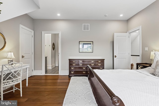 bedroom with dark wood-type flooring