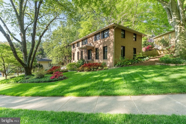 view of property exterior featuring a lawn