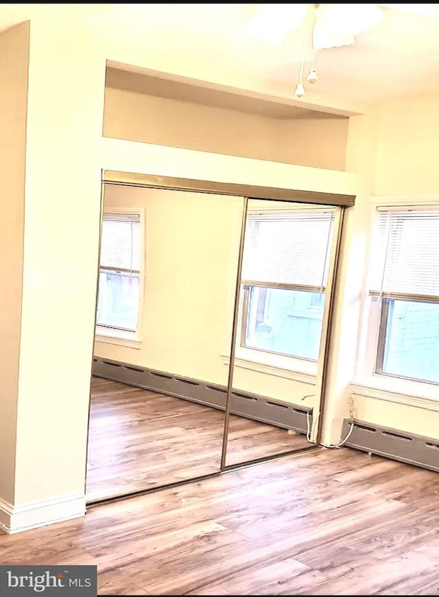 closet with a baseboard radiator