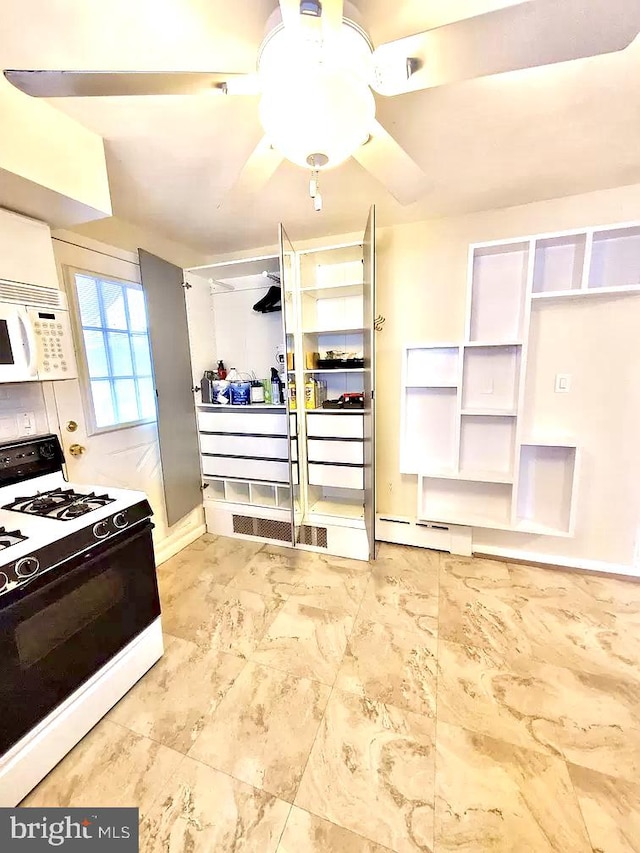 kitchen with ceiling fan and white appliances