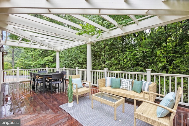 wooden terrace featuring an outdoor hangout area, outdoor dining space, and a pergola