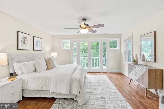 bedroom with access to exterior, ceiling fan, and light wood-type flooring