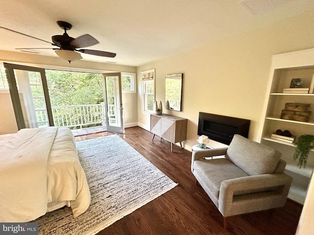 bedroom with access to outside, baseboards, ceiling fan, and wood finished floors