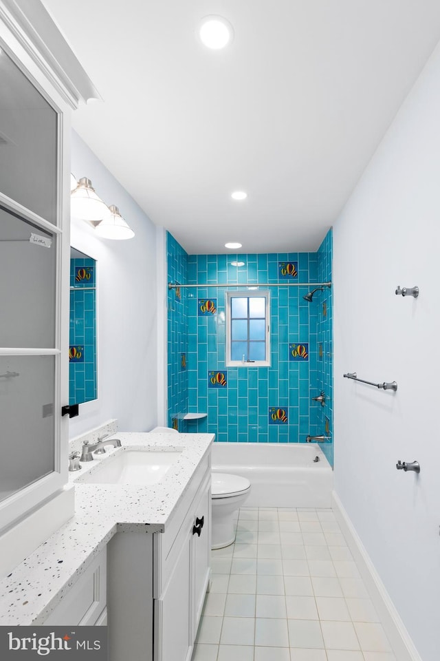 full bath with shower / bathtub combination, toilet, vanity, baseboards, and tile patterned floors