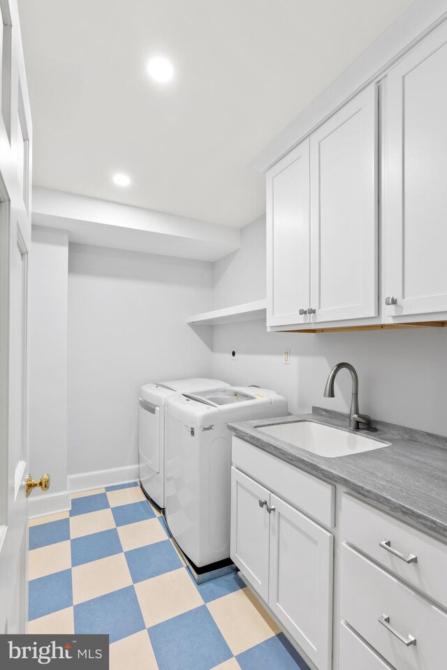 laundry area with washer and clothes dryer, light floors, recessed lighting, cabinet space, and a sink