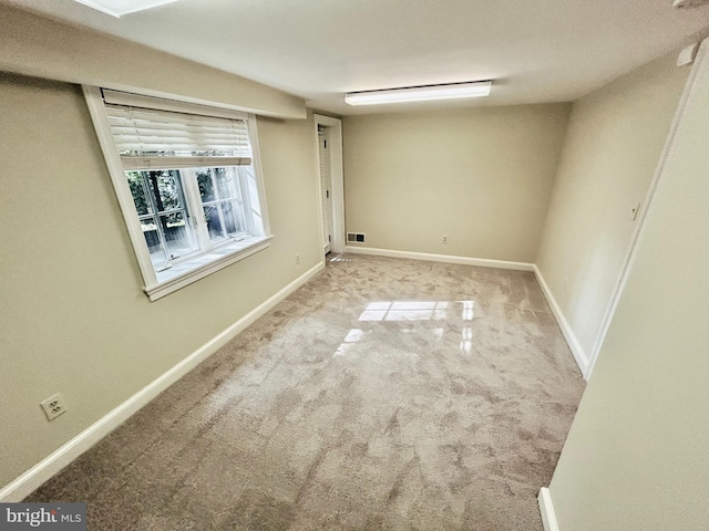 empty room with light colored carpet