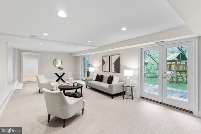 living room featuring baseboards, french doors, visible vents, and recessed lighting