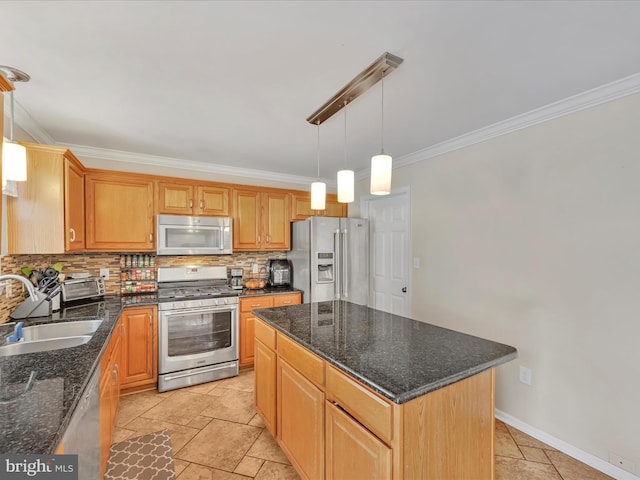 kitchen with sink, a kitchen island, decorative light fixtures, and stainless steel appliances