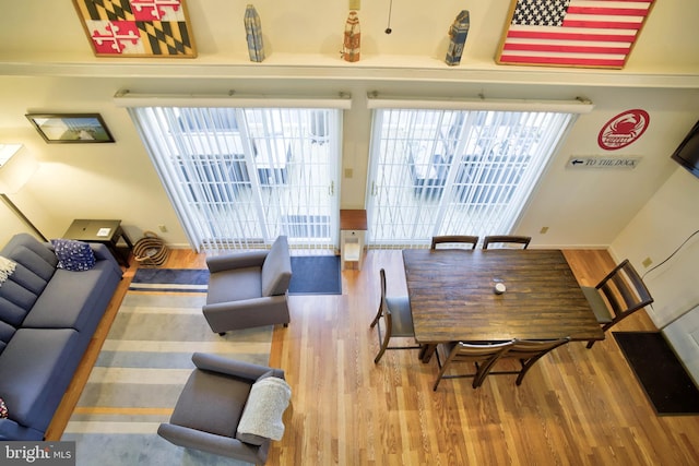 dining area with wood finished floors