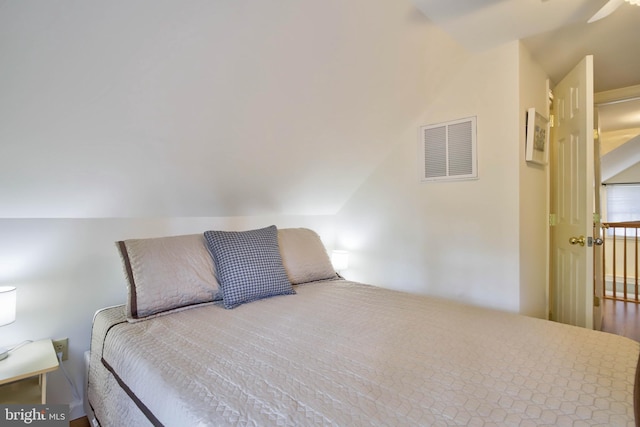 bedroom with visible vents and lofted ceiling