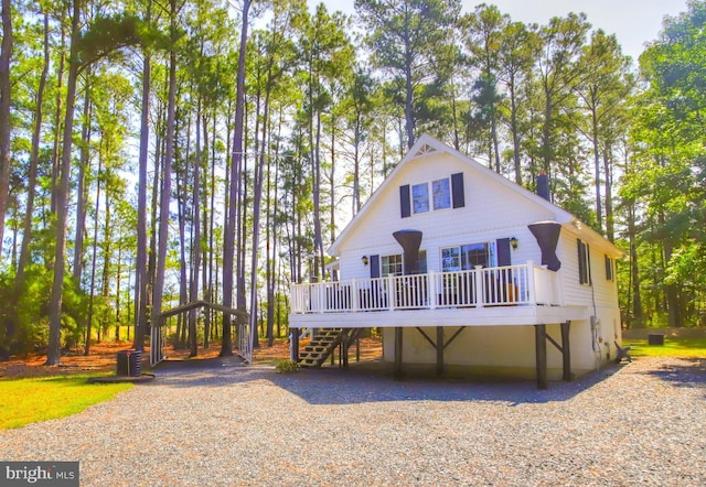 back of house with a wooden deck