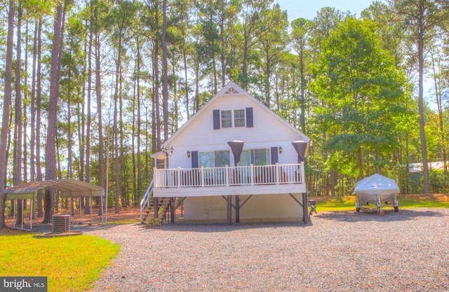 view of front of house featuring a wooden deck and stairs
