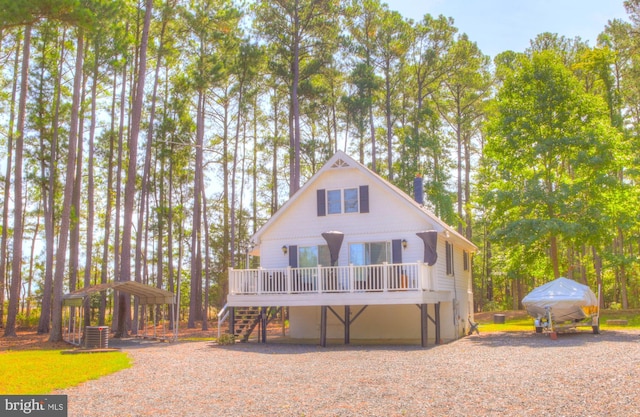 exterior space featuring stairs, a deck, and central AC