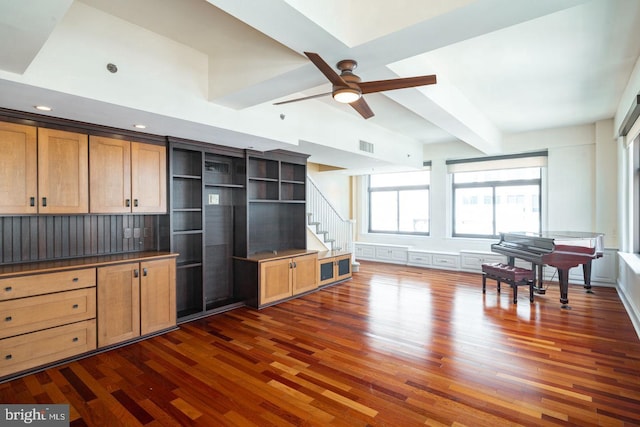 kitchen featuring ceiling fan and dark hardwood / wood-style flooring