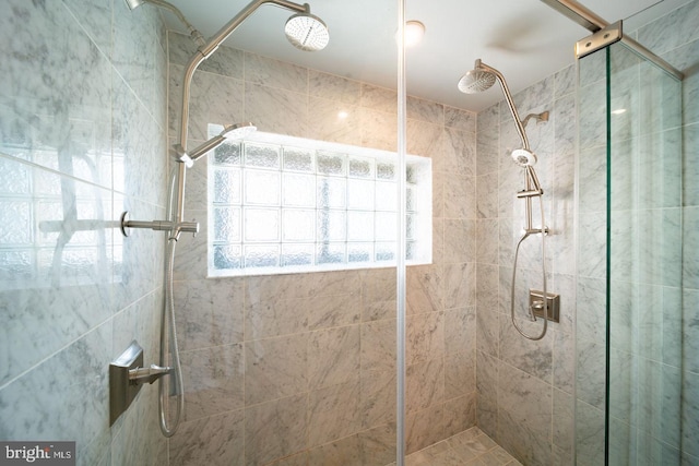 bathroom with a shower with shower door