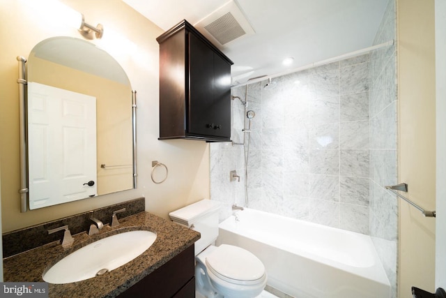 full bathroom with vanity, toilet, and tiled shower / bath combo